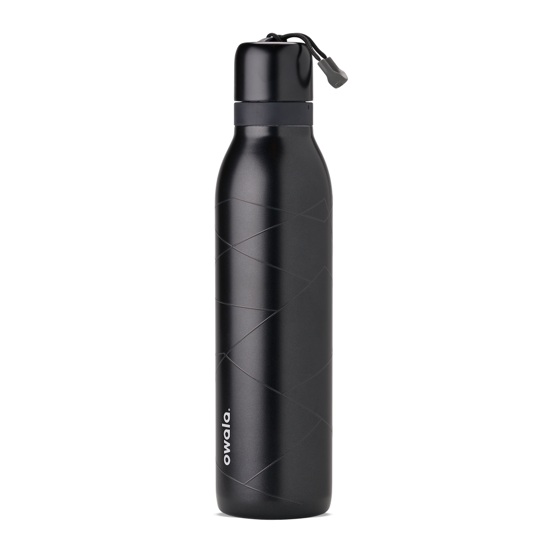 Owala Birthday Bash Lights Camera Action 24oz FreeSip Twist bottle in matte black with subtle tonal geometric line pattern, matching black twist cap, dark gray accent band, and black carry string with gray grip