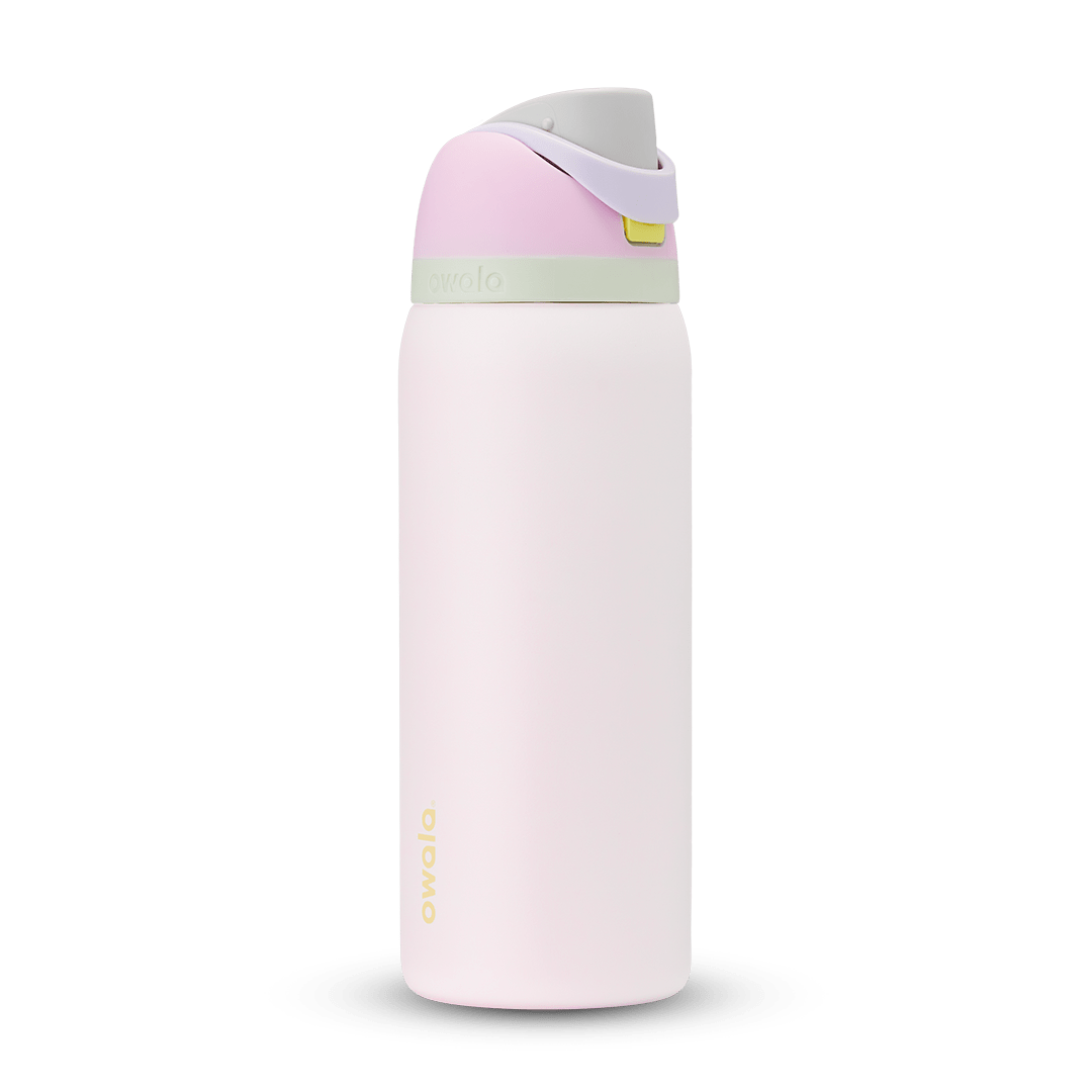 FreeSip 32oz in Candy Coated; soft pink body with pink flip cap, lavender carry loop, sage green accent band on the lid, and yellow push-button