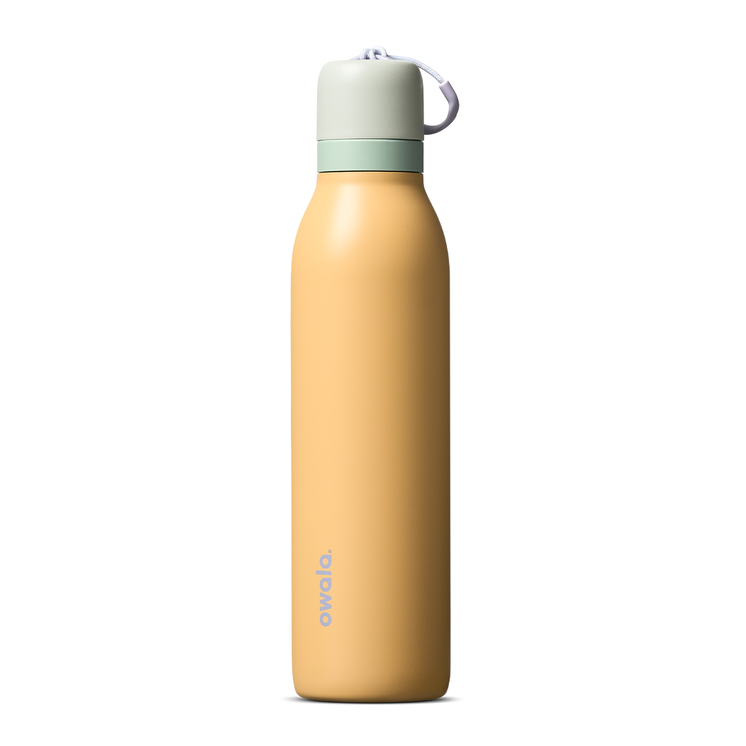 FreeSip Twist 24oz in Beachfront (muted golden yellow) with a pale mint green lid and white loop, shown