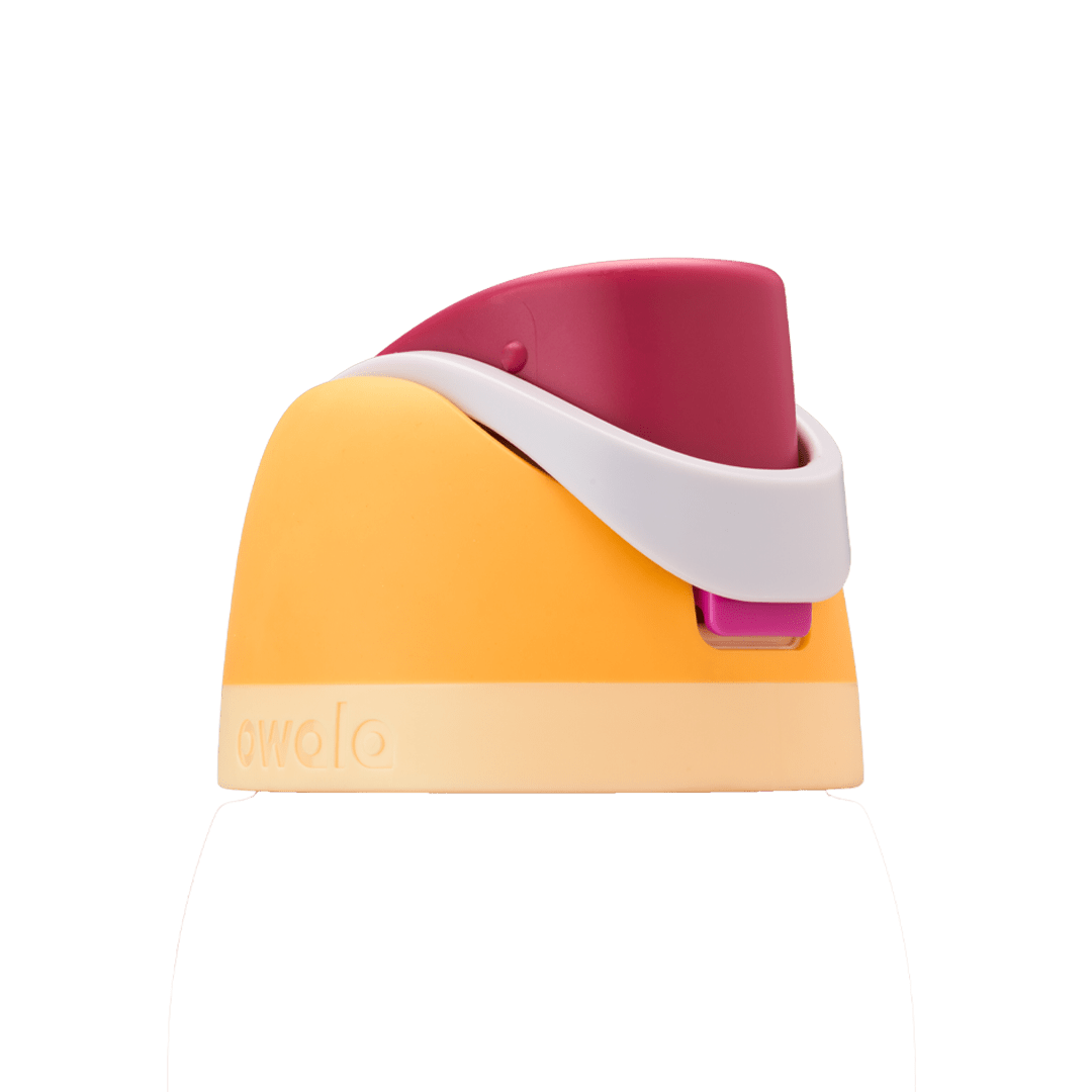 Owala FreeSip replacement lid in Citrus Crush, golden orange body with magenta pink flip cap, white carry loop, and pale yellow base accent band