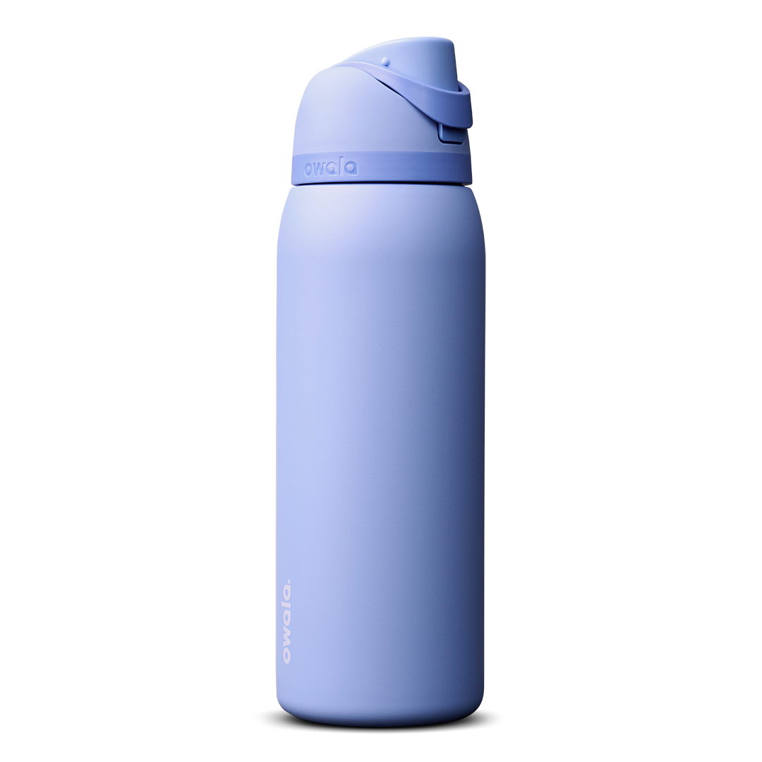 Owala FreeSip 40oz in Out of the Blue, periwinkle blue insulated bottle with matching blue-lavender flip cap and carry loop