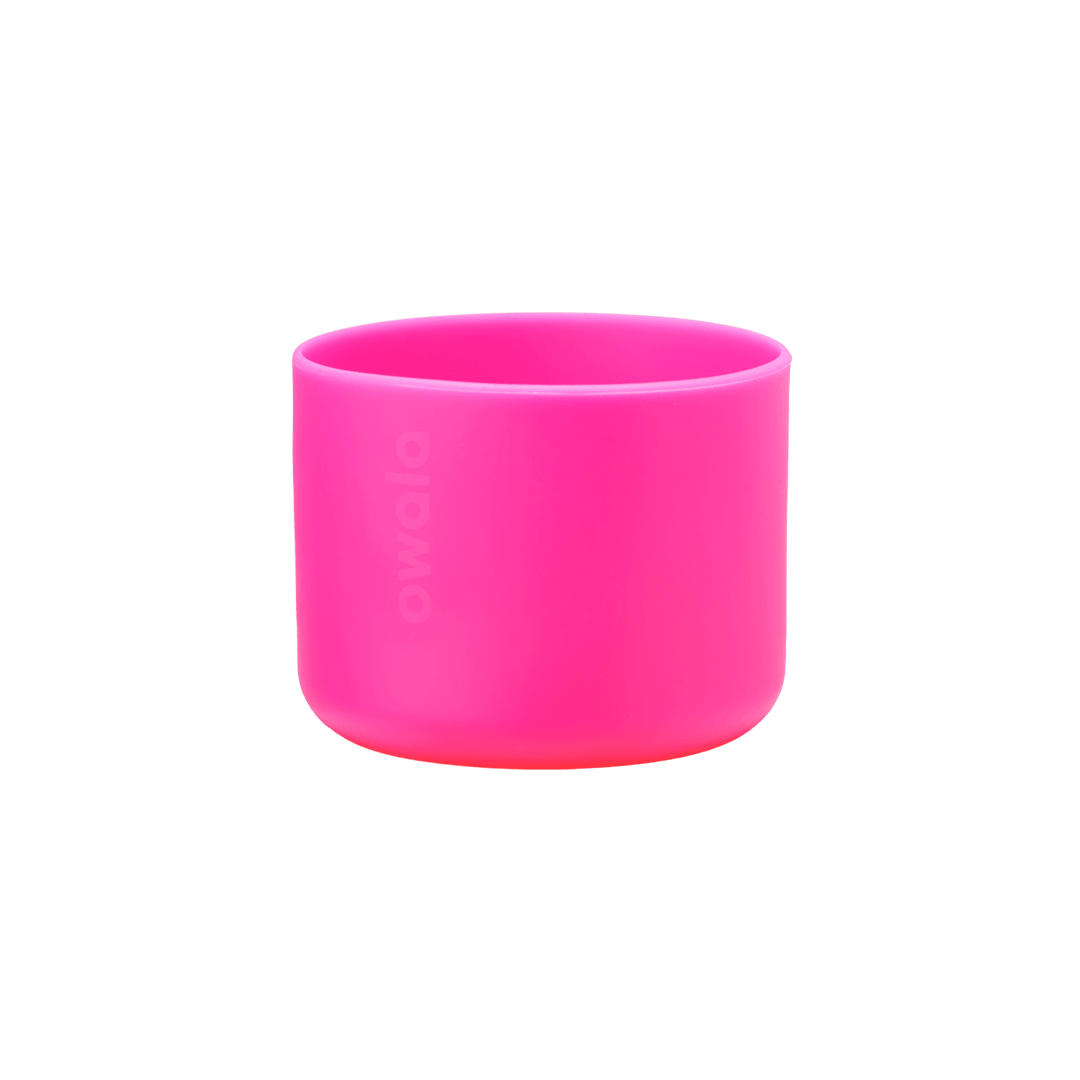 Owala Bottle Boot in vivid hot pink silicone with tonal Owala logo, wide short cylindrical form sized for the 32oz bottle